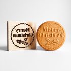 Merry Christmas feliratú fa sütipecsét és mézeskalács